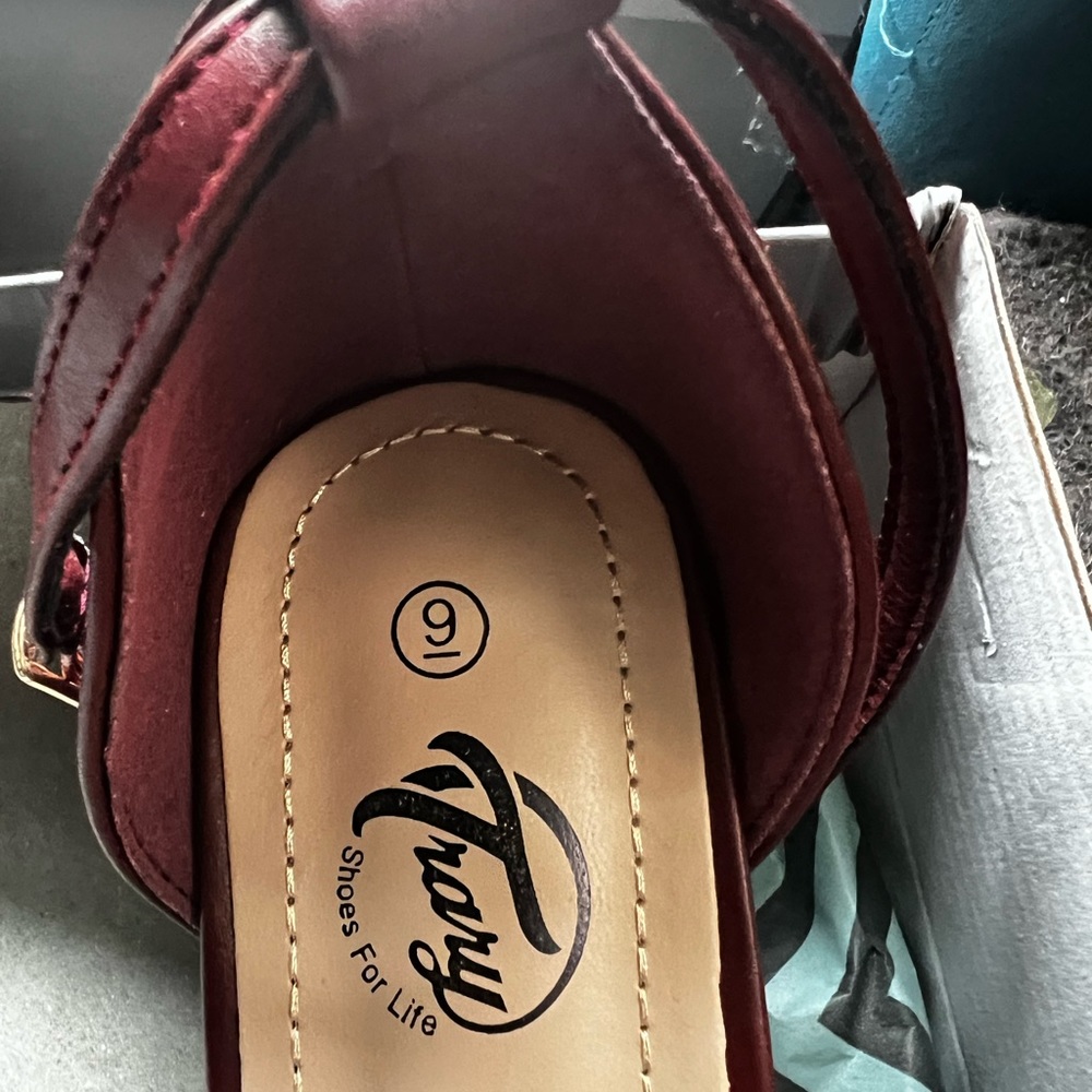 Brand new never worn dress heals. Wine color.